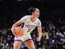 James Madison player #11 in purple uniform with ball