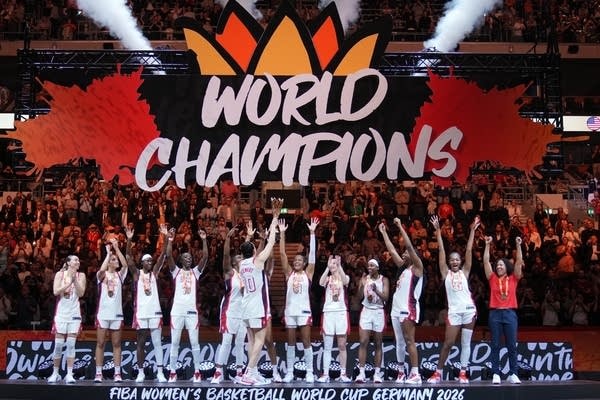 Team USA Women's Basketball celebrating on the podium at the 2026 FIBA World Cup in Berlin