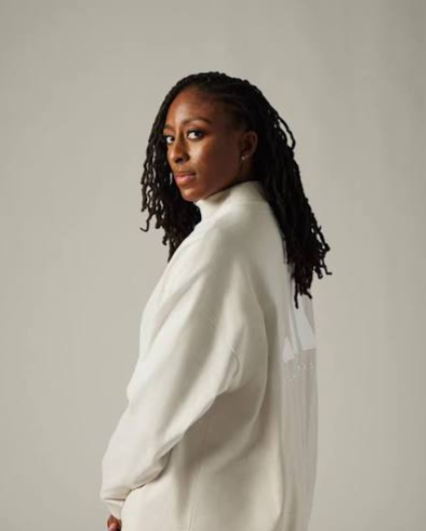 Nneka Ogwumike in a white sweater — WNBPA president and UCAA advisor