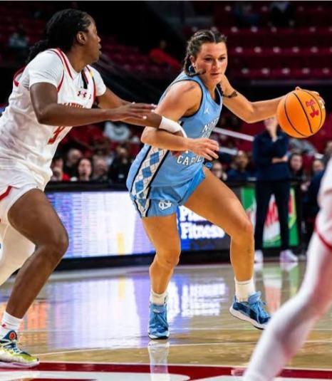Kate Harpring driving to the basket against Maryland
